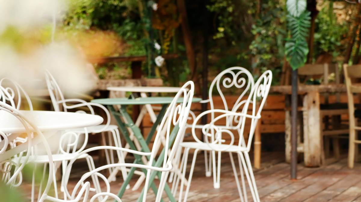 what is garden furniture made of - close-up of aluminum parasol frame with UV-resistant canopy fabric in a sunny backyard