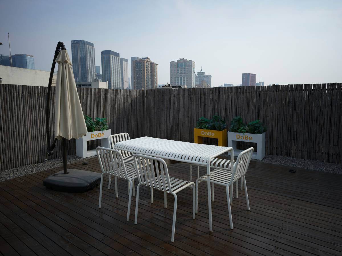 Sturdy garden furniture essex setup with wind-resistant parasol on stone patio