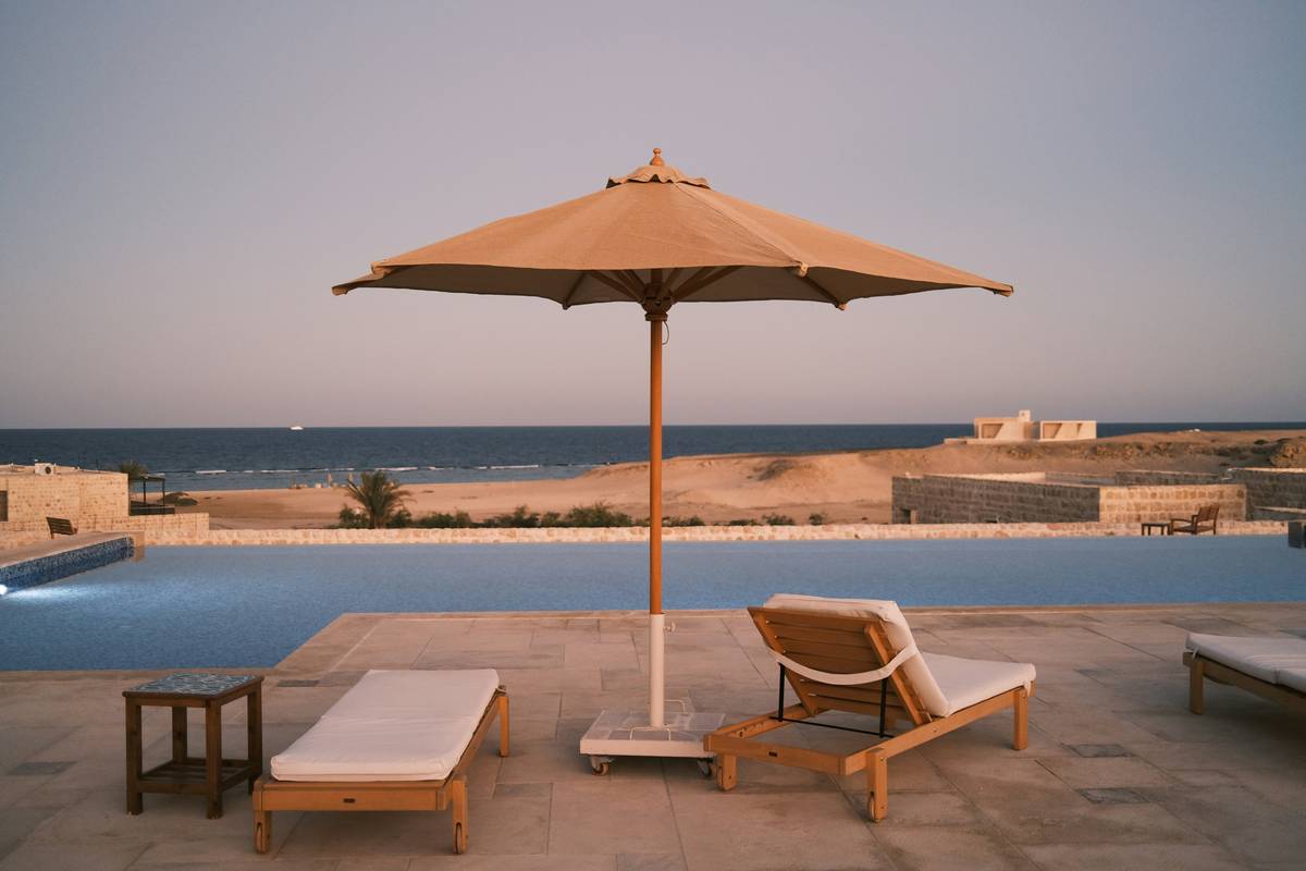 wooden parasols for garden with teak frame and canvas canopy on stone patio